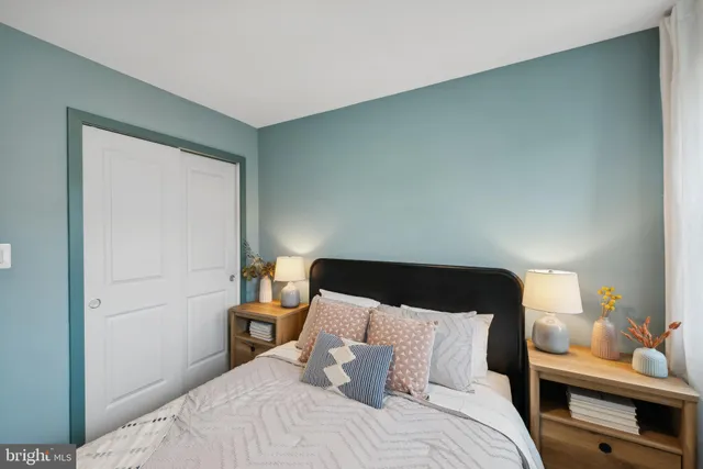 a bedroom with a bed and window