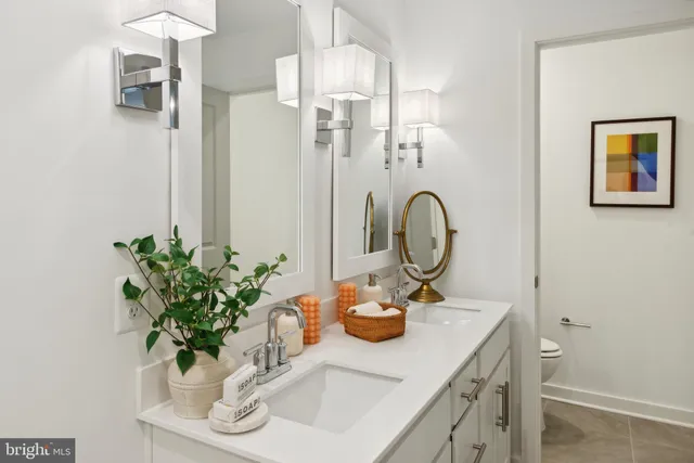 a bathroom with a sink a vanity and a mirror