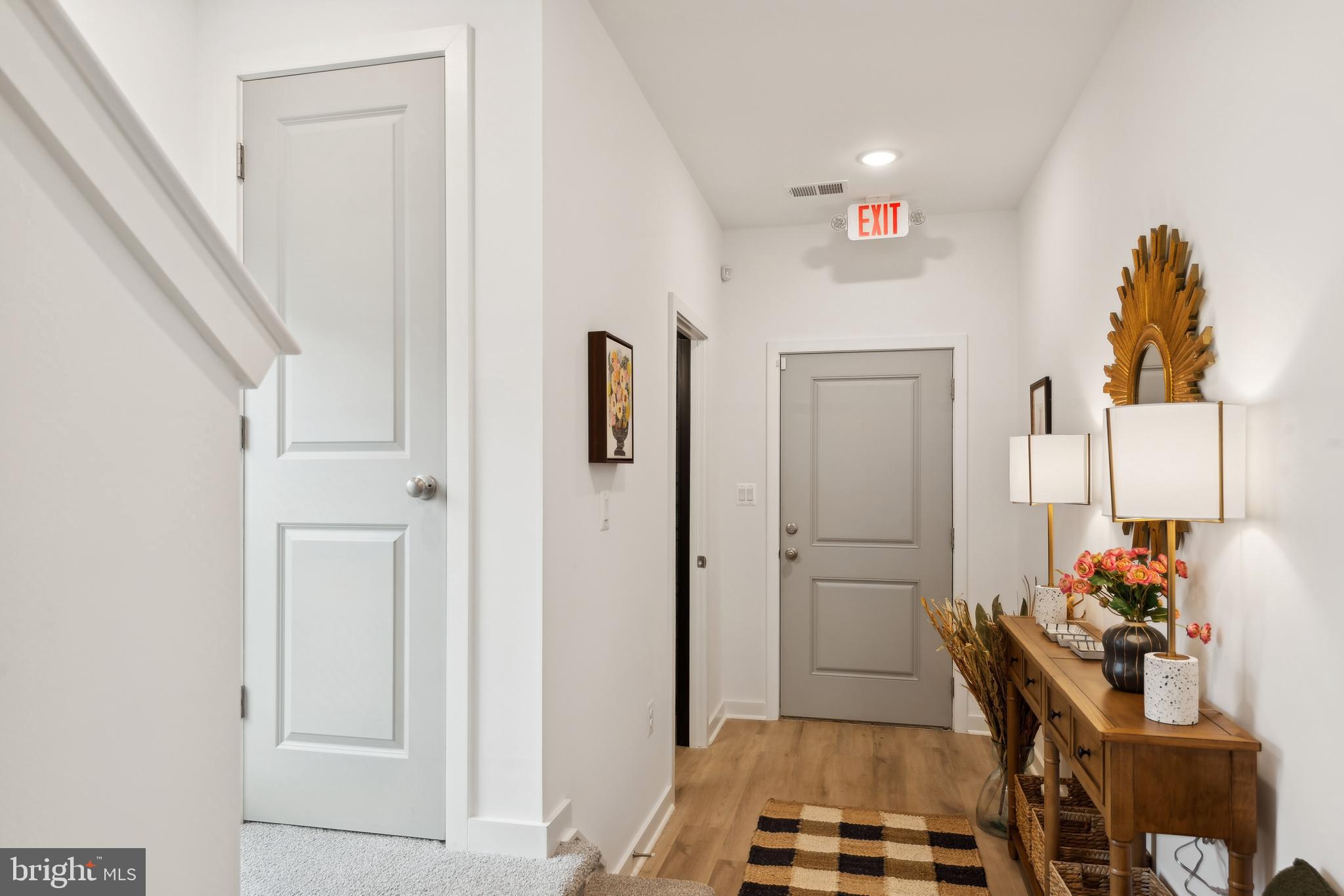 0 Cougar Lane Locust Grove, VA 22508 - Photo 3 of 30 a hallway with a white cabinets and wooden floor