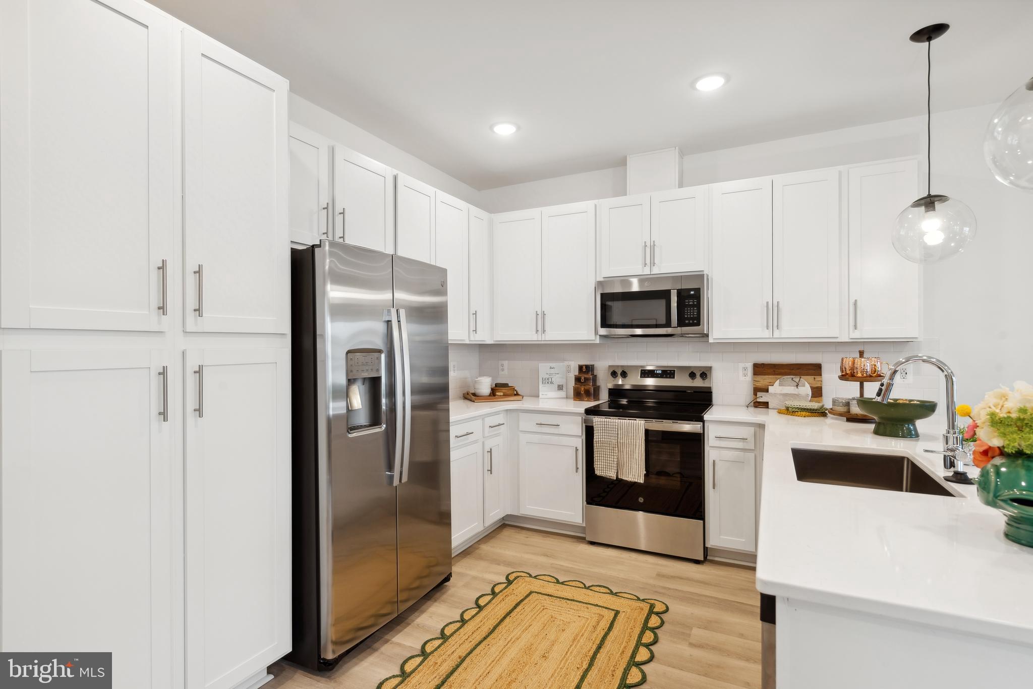 0 Cougar Lane Locust Grove, VA 22508 - Photo 6 of 30 a kitchen with stainless steel appliances granite countertop a refrigerator sink and microwave