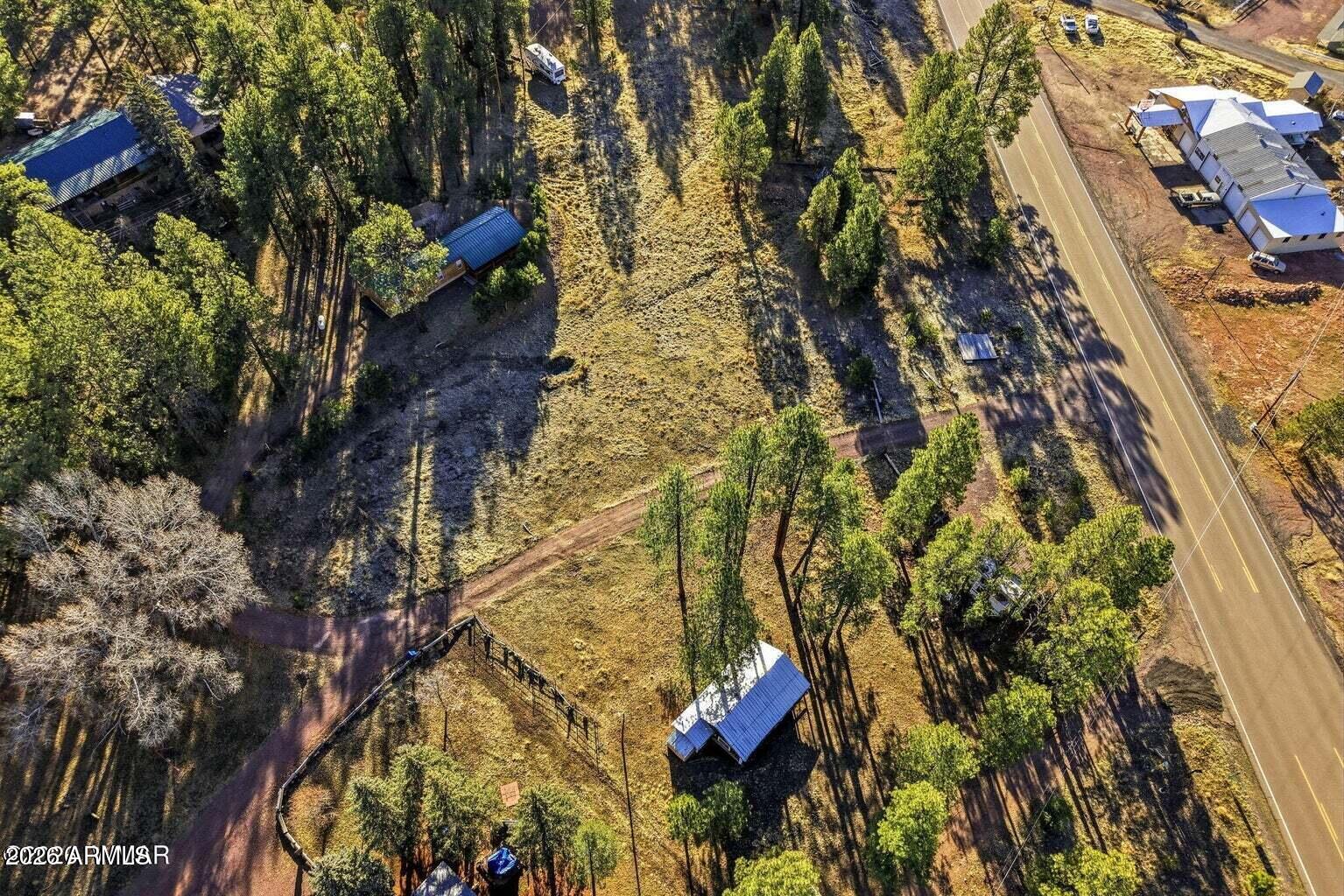 2 North County Road Alpine, AZ 85920 - Photo 12 of 16 an aerial view of residential houses with outdoor space
