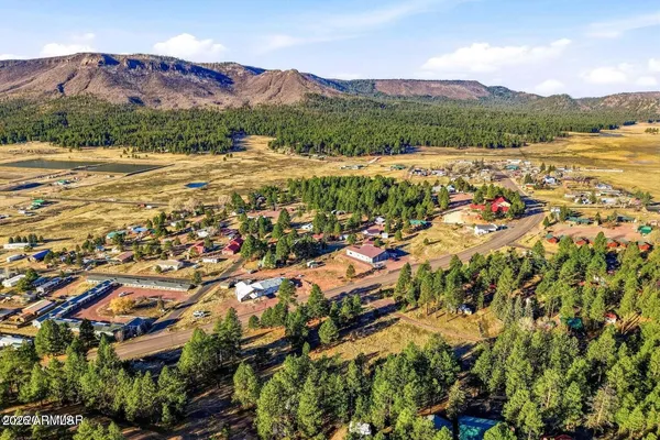 an aerial view of residential house and sandy space