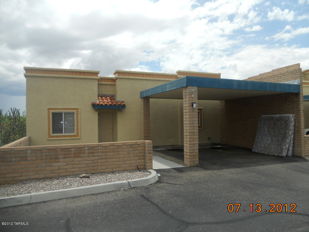 3516 South Mission Road, Unit 1 Tucson, AZ 85713 - Photo 1 of 9 front view of a house with a garage