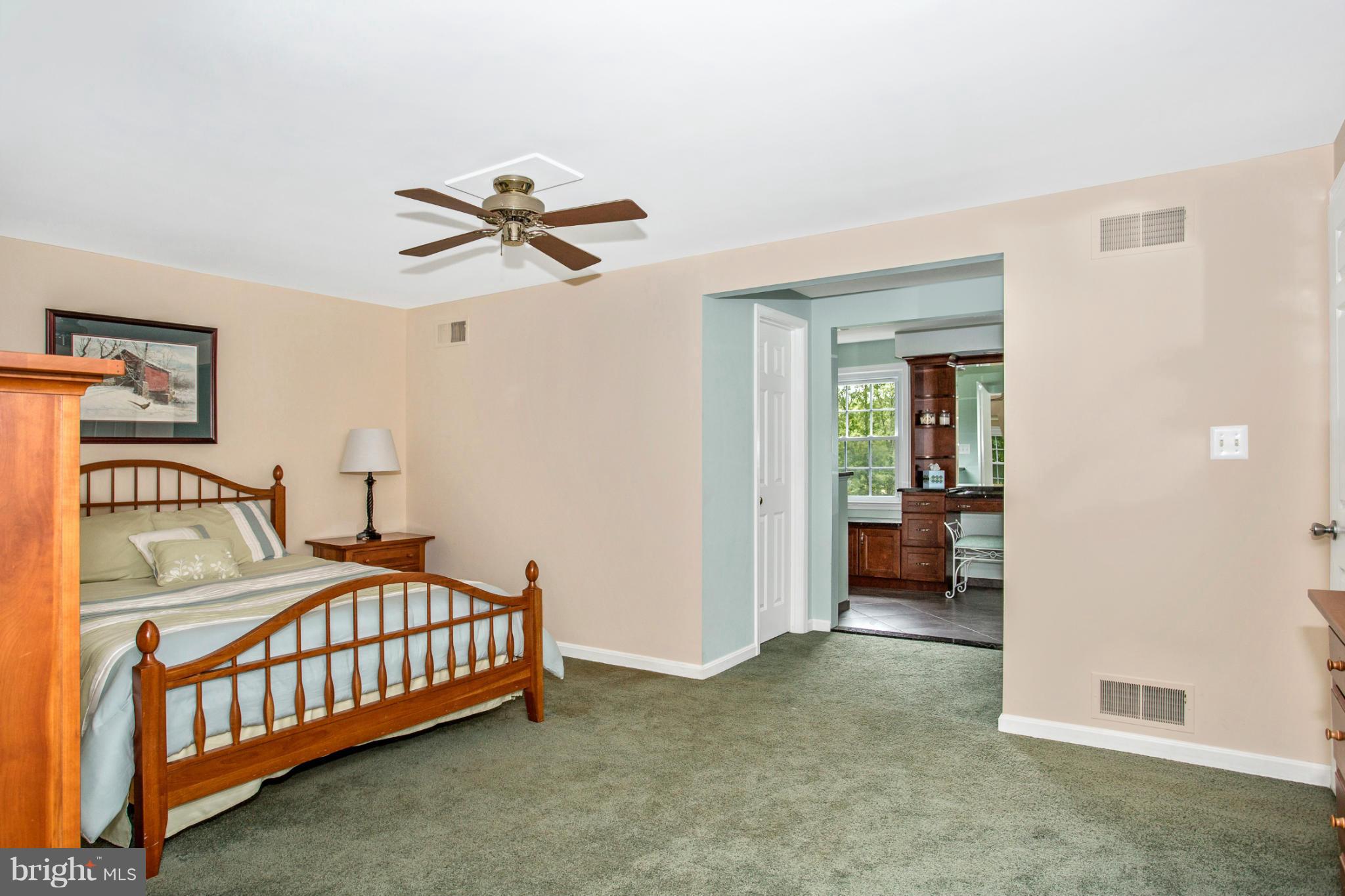 17610 Conoy Road Barnesville, MD 20838 - Photo 22 of 30 a bedroom with a bed and a chandelier