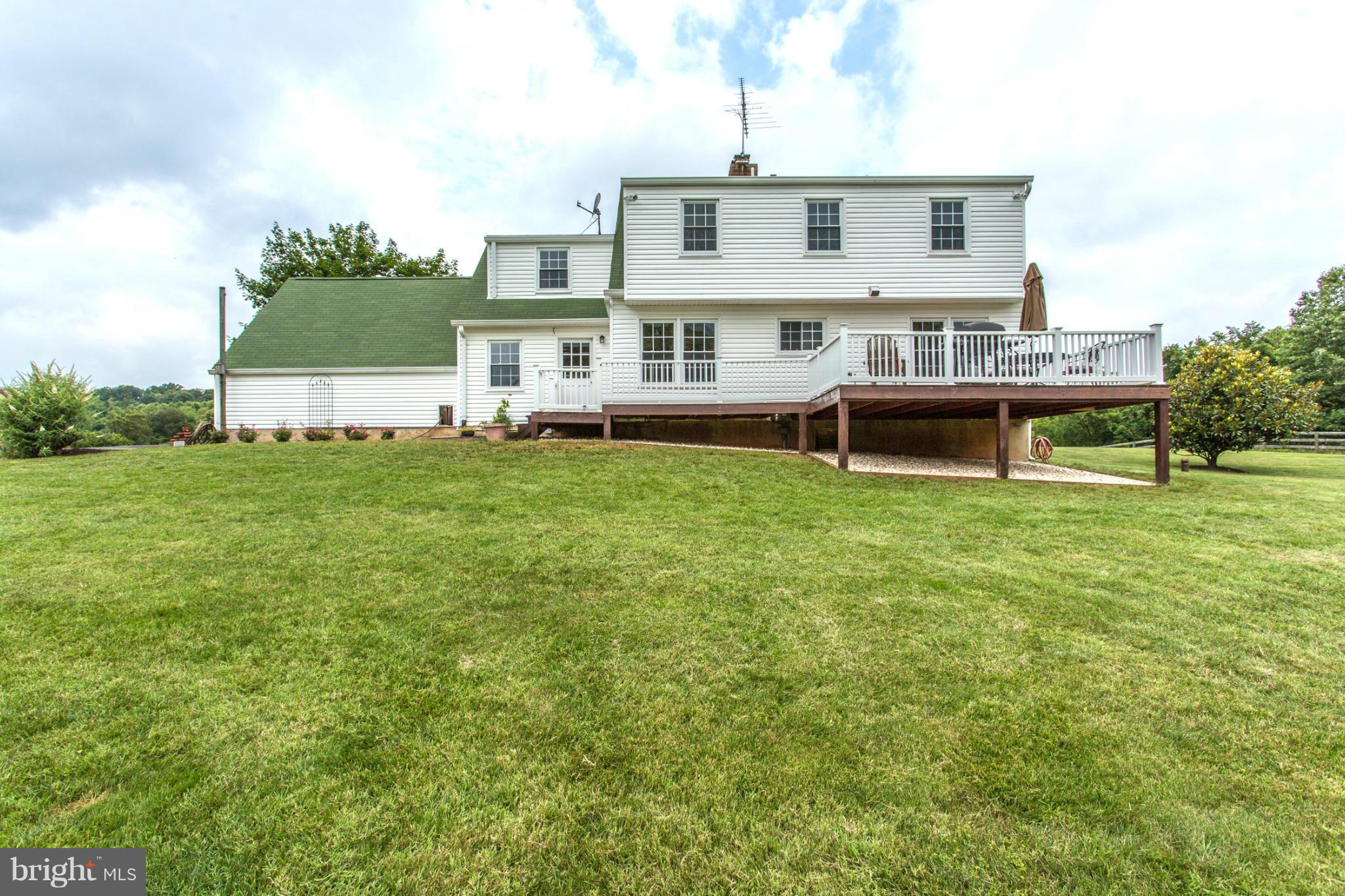 17610 Conoy Road Barnesville, MD 20838 - Photo 5 of 30 a view of a house with a backyard