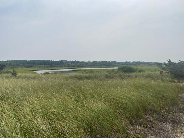 9 Maqua Way Edgartown, MA 02539 - Photo 9 of 9 a view of a lake with houses in the back