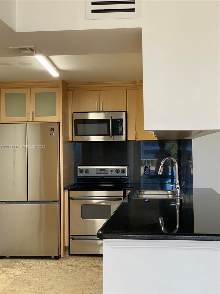 177 Ocean Ln Drive, Unit 505 Key Biscayne, FL 33149 - Photo 12 of 26 a kitchen with a refrigerator and a stove