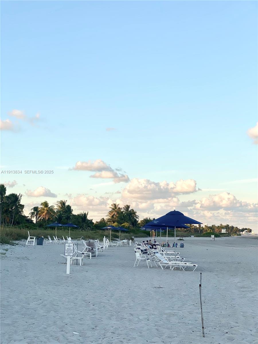 177 Ocean Ln Drive, Unit 505 Key Biscayne, FL 33149 - Photo 26 of 26 a view of a lake with a mountain in the background