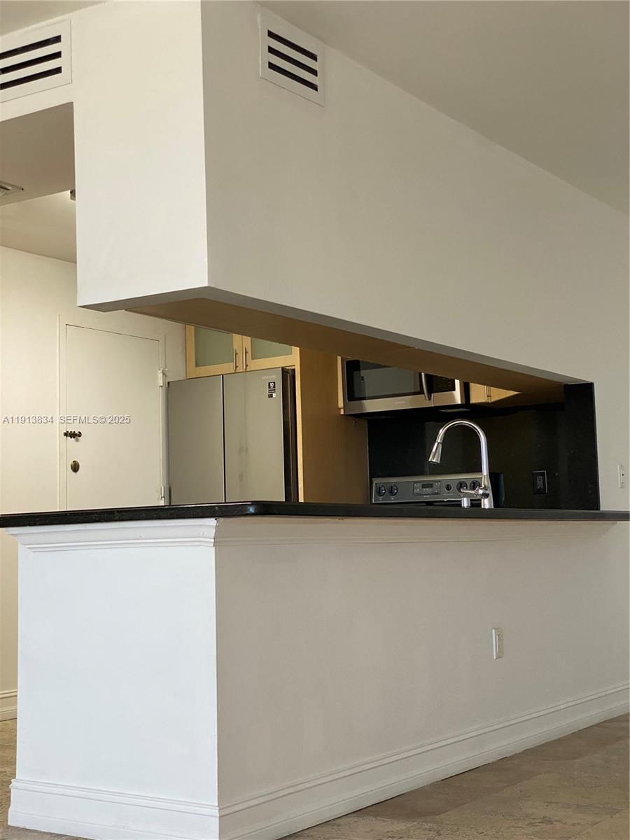 177 Ocean Ln Drive, Unit 505 Key Biscayne, FL 33149 - Photo 10 of 26 a close up of a utility room with cabinets