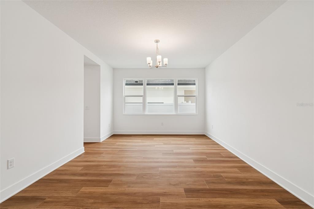 809 West Indiana Avenue Tampa, FL 33603 - Photo 13 of 64 a view of an empty room with window and wooden floor