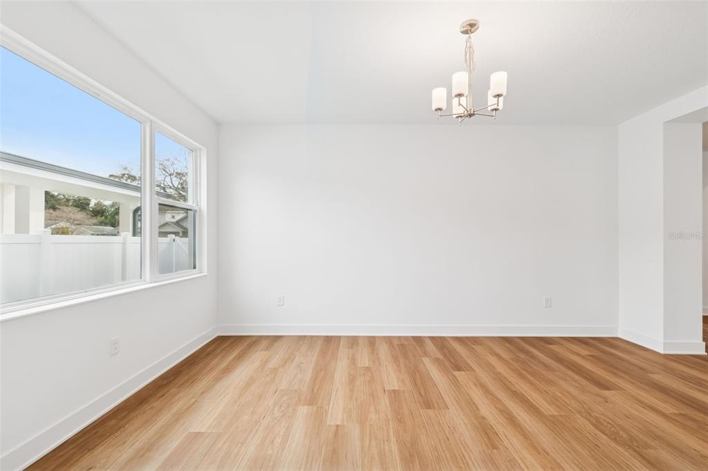 809 West Indiana Avenue Tampa, FL 33603 - Photo 15 of 64 a view of a room with wooden floor and white walls
