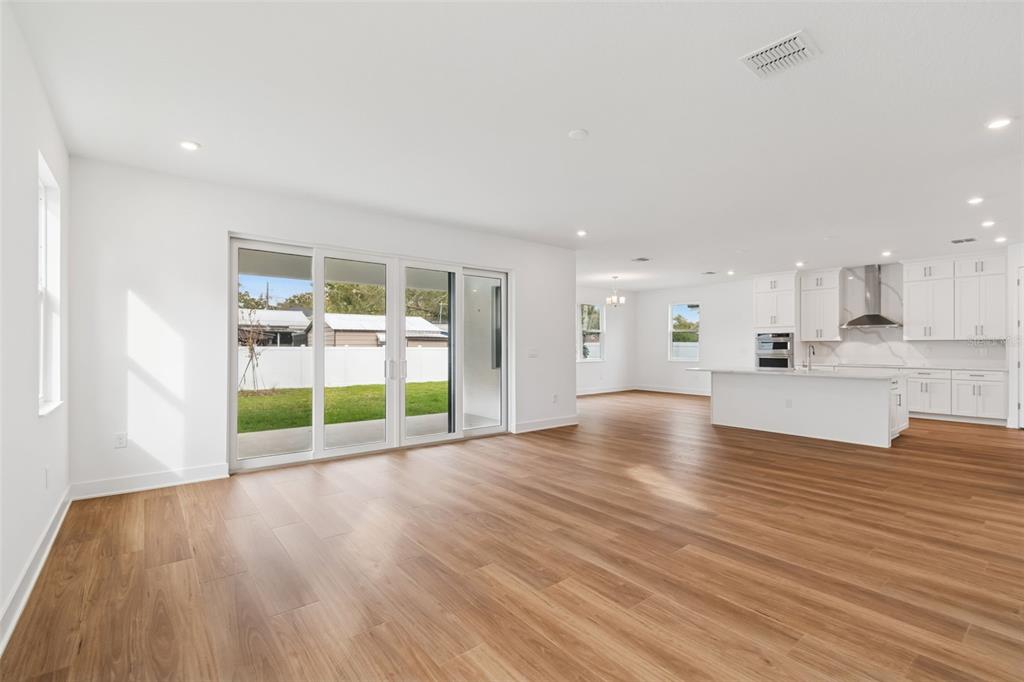 809 West Indiana Avenue Tampa, FL 33603 - Photo 17 of 64 a view of an empty room with wooden floor and a window