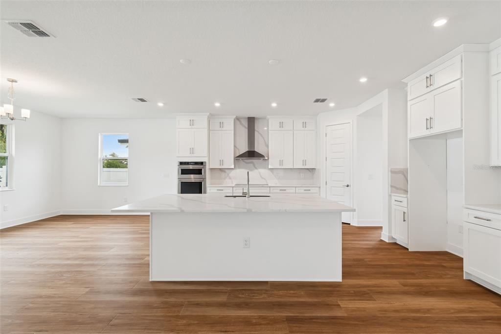 809 West Indiana Avenue Tampa, FL 33603 - Photo 25 of 64 a large kitchen with stainless steel appliances refrigerator sink and cabinets