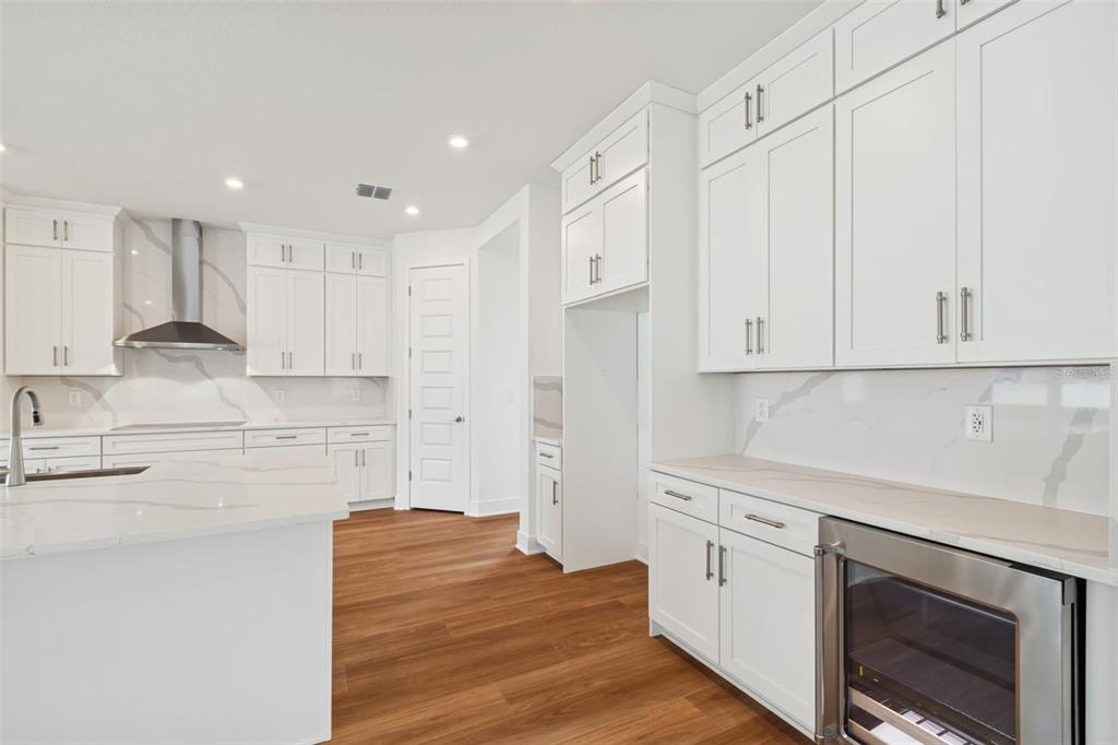 809 West Indiana Avenue Tampa, FL 33603 - Photo 26 of 64 a kitchen with stainless steel appliances white cabinets and a refrigerator