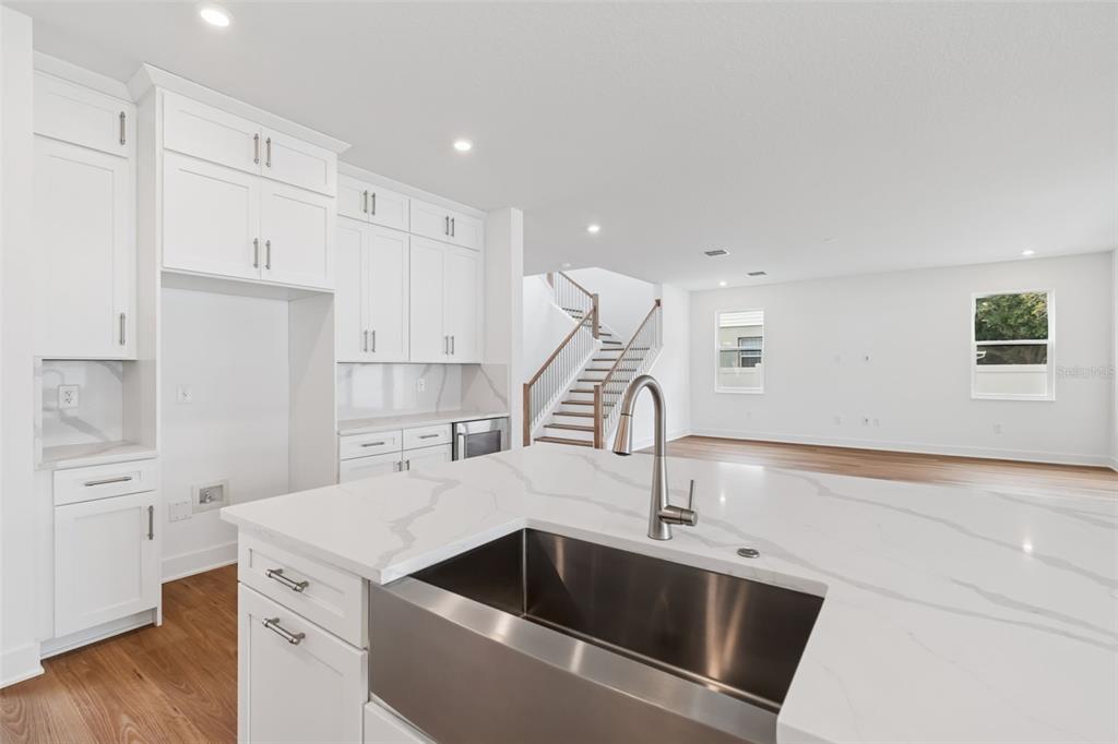 809 West Indiana Avenue Tampa, FL 33603 - Photo 32 of 64 a kitchen that has a sink a stove and a wooden floor