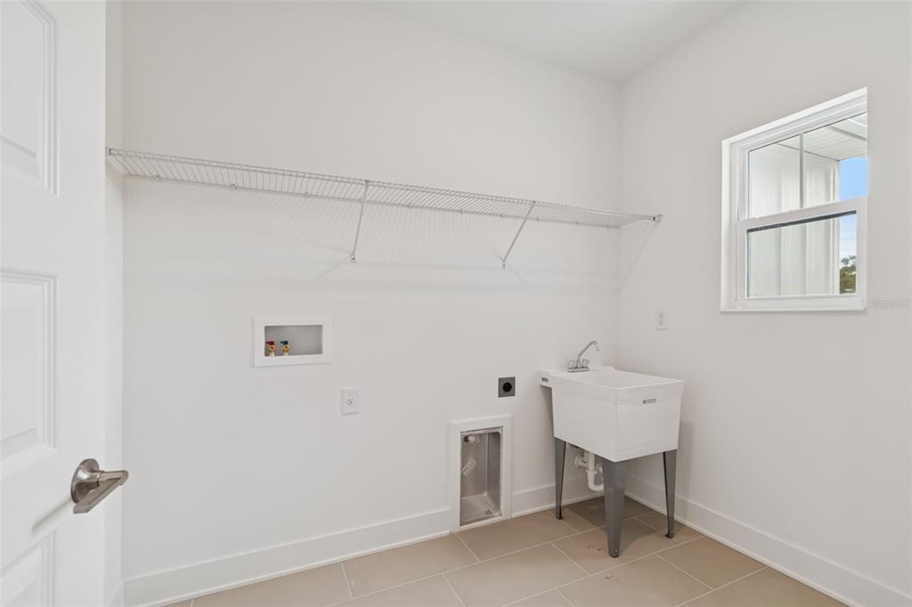 809 West Indiana Avenue Tampa, FL 33603 - Photo 53 of 64 a view of a room with rack on the wall