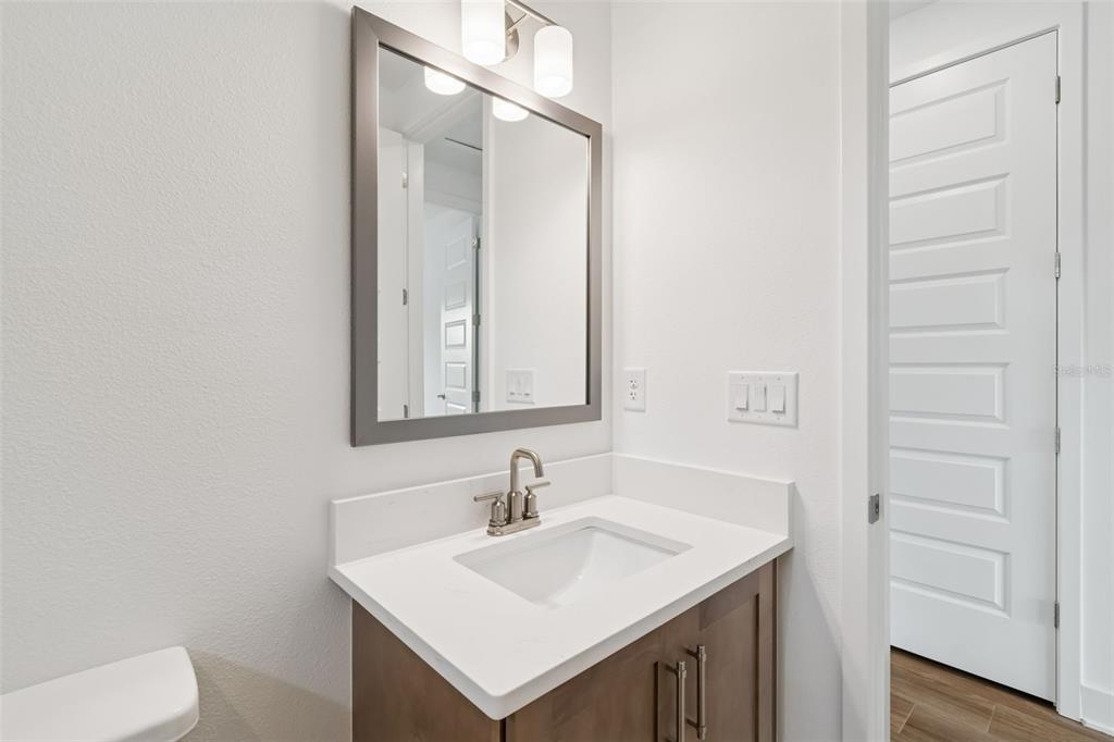 809 West Indiana Avenue Tampa, FL 33603 - Photo 57 of 64 a bathroom with a sink a toilet and mirror