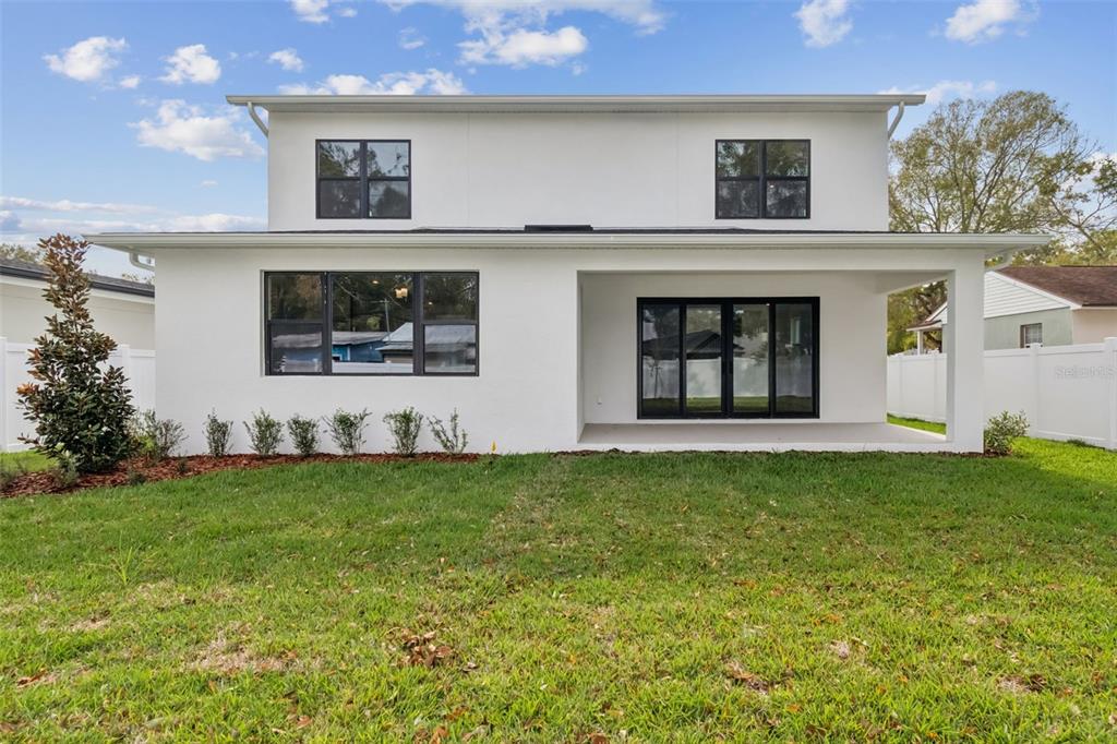 809 West Indiana Avenue Tampa, FL 33603 - Photo 60 of 64 a front view of a house with a yard