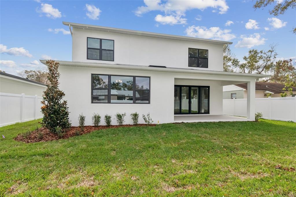 809 West Indiana Avenue Tampa, FL 33603 - Photo 61 of 64 a front view of a house with a yard
