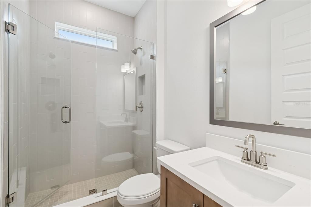 809 West Indiana Avenue Tampa, FL 33603 - Photo 9 of 64 a bathroom with a sink a toilet and shower