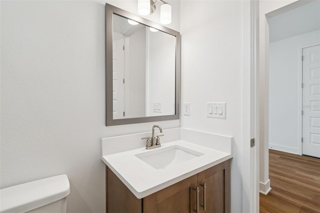 809 West Indiana Avenue Tampa, FL 33603 - Photo 10 of 64 a bathroom with a sink toilet and vanity