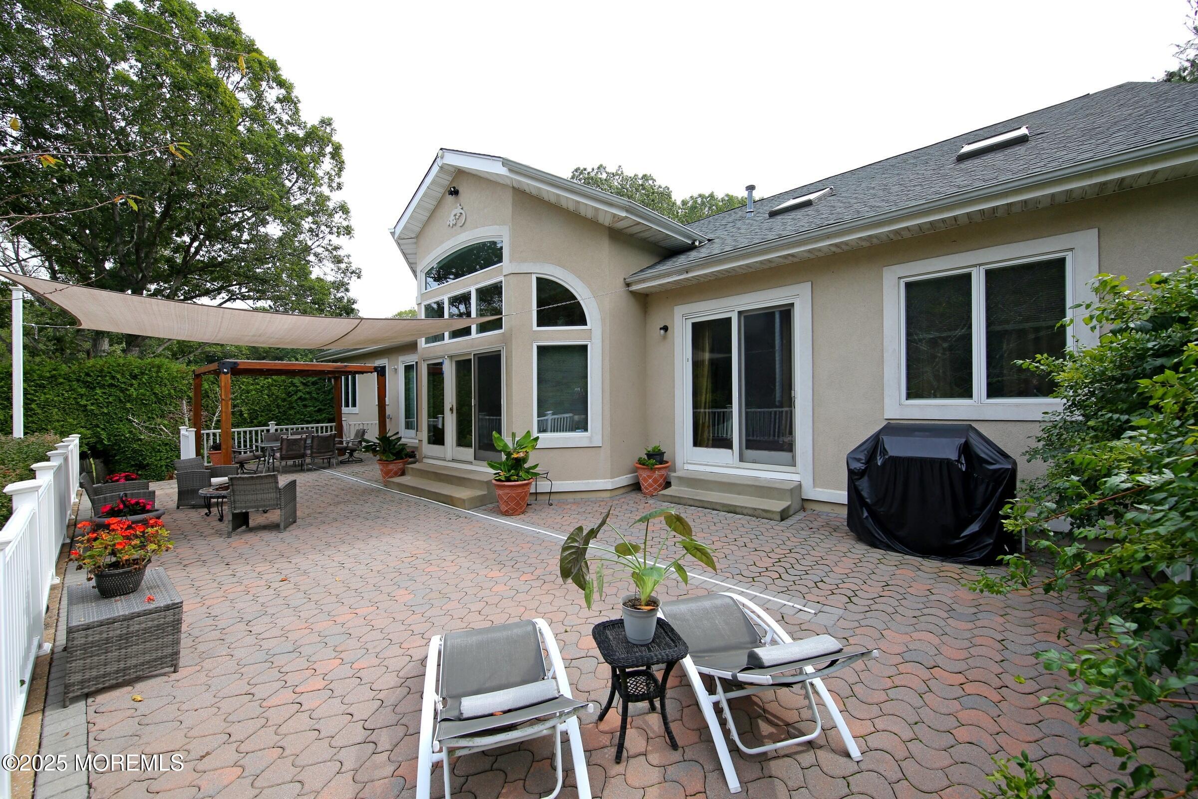 15 Gun Club Road Tinton Falls, NJ 07712 - Photo 25 of 51 Raised paver patio