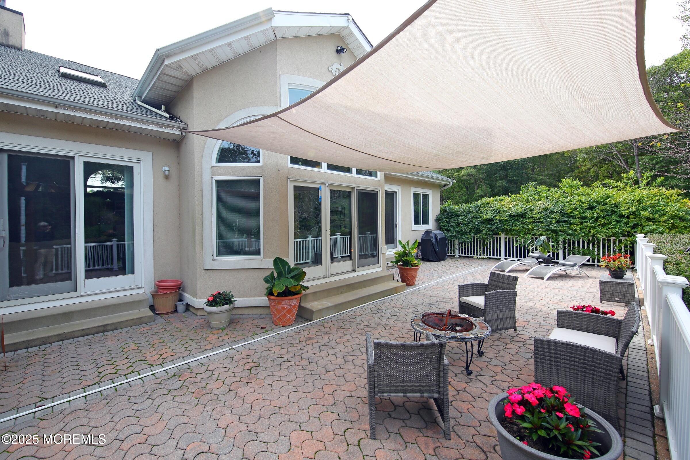 15 Gun Club Road Tinton Falls, NJ 07712 - Photo 38 of 51 Inviting paver patio