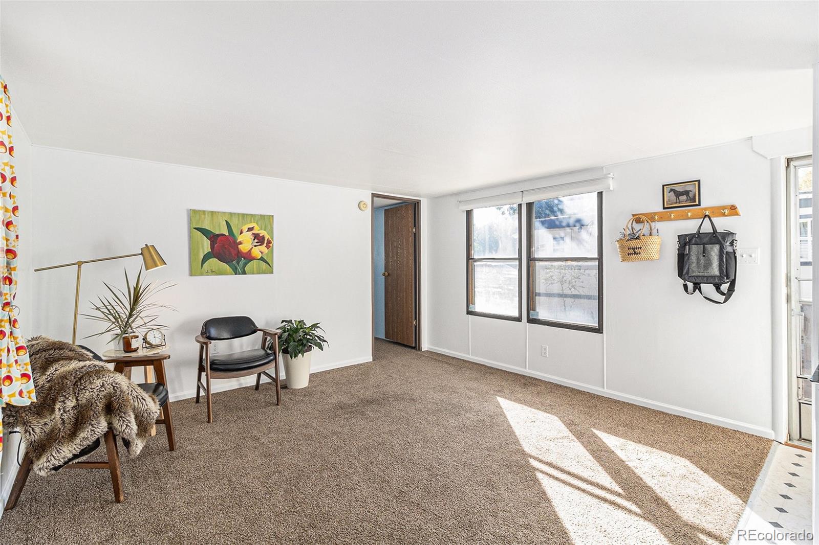 a view of livingroom with furniture and window