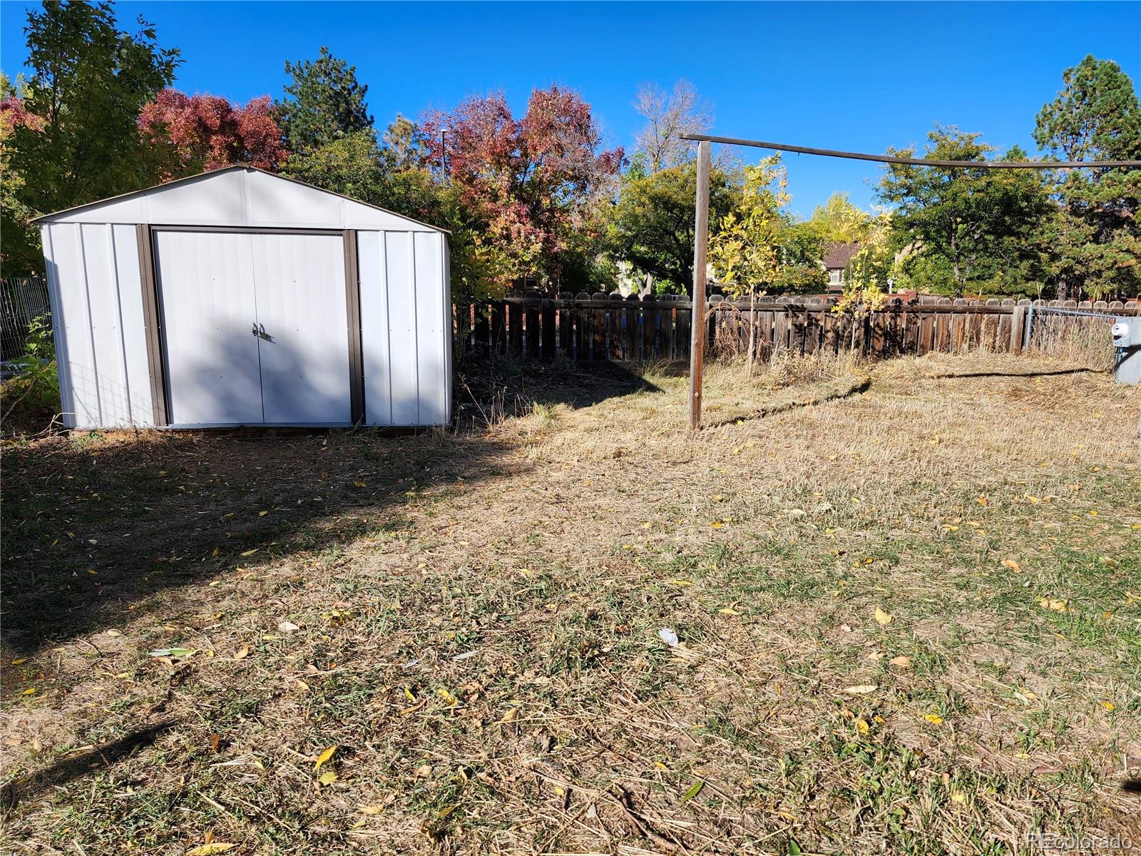 400 West South Boulder Road Louisville, CO 80027 - Photo 13 of 24 a view of a yard with a house in the background