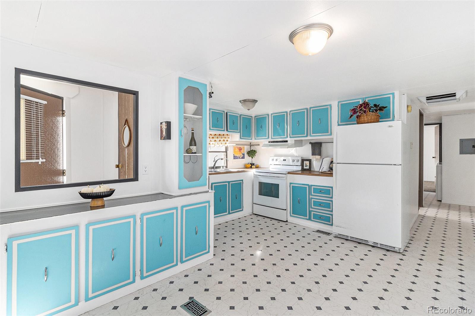 400 West South Boulder Road Louisville, CO 80027 - Photo 5 of 24 a kitchen with granite countertop appliances a sink and a refrigerator