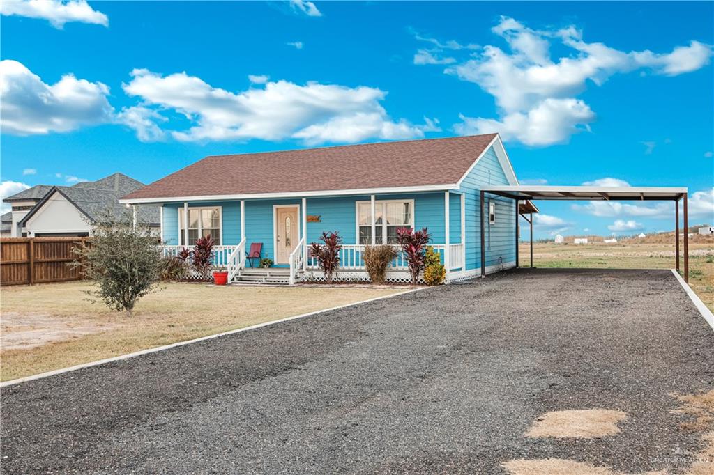 10514 Crocosmia Lane Edcouch, TX 78538 - Photo 4 of 22 a group of people sitting in front of a house
