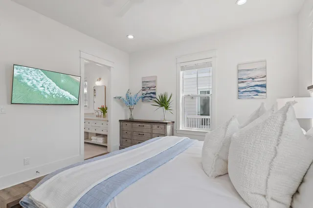 a bathroom with a granite countertop sink a toilet and a mirror