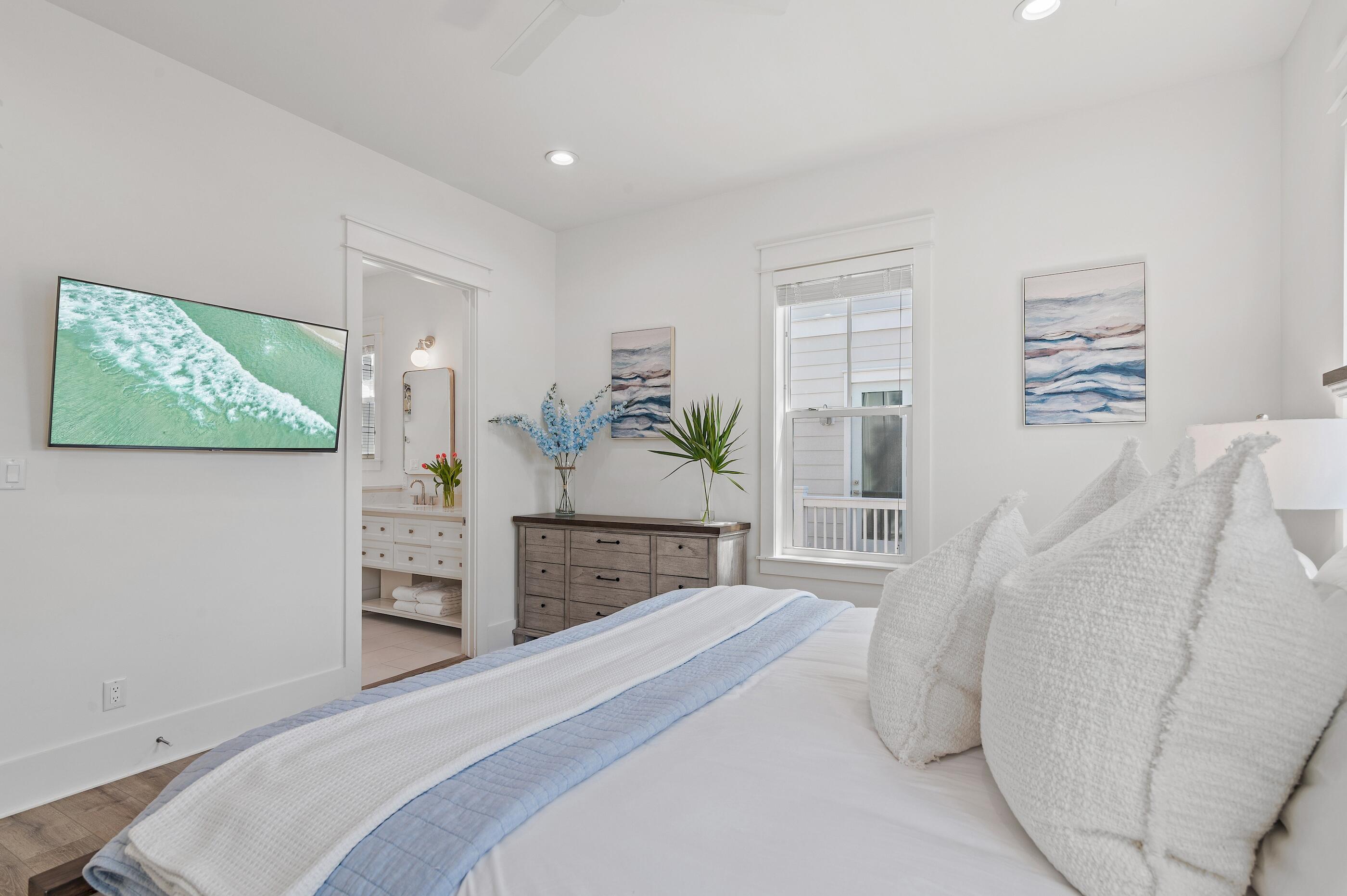 63 Sawgrass Lane Santa Rosa Beach, FL 32459 - Photo 14 of 51 a bedroom with a bed and a cabinets