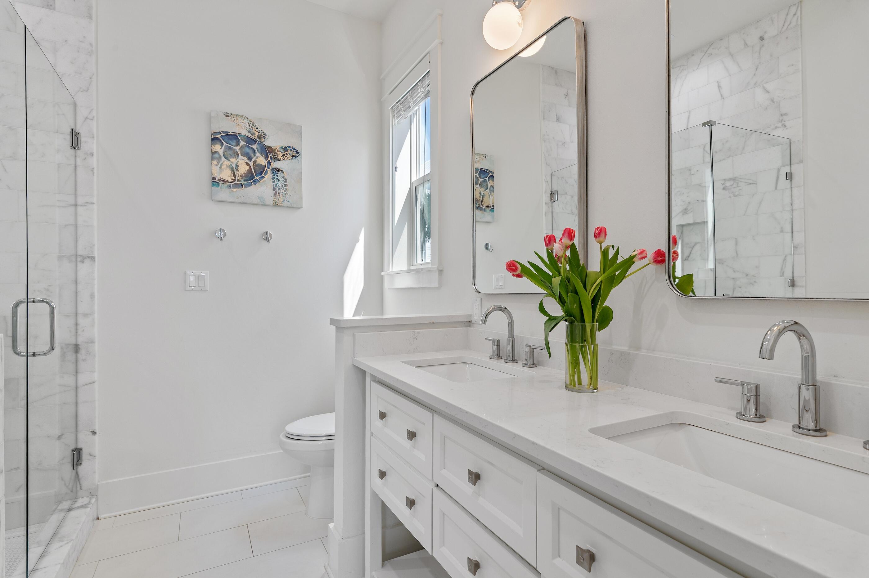 63 Sawgrass Lane Santa Rosa Beach, FL 32459 - Photo 15 of 51 a bathroom with a granite countertop sink a toilet and a mirror