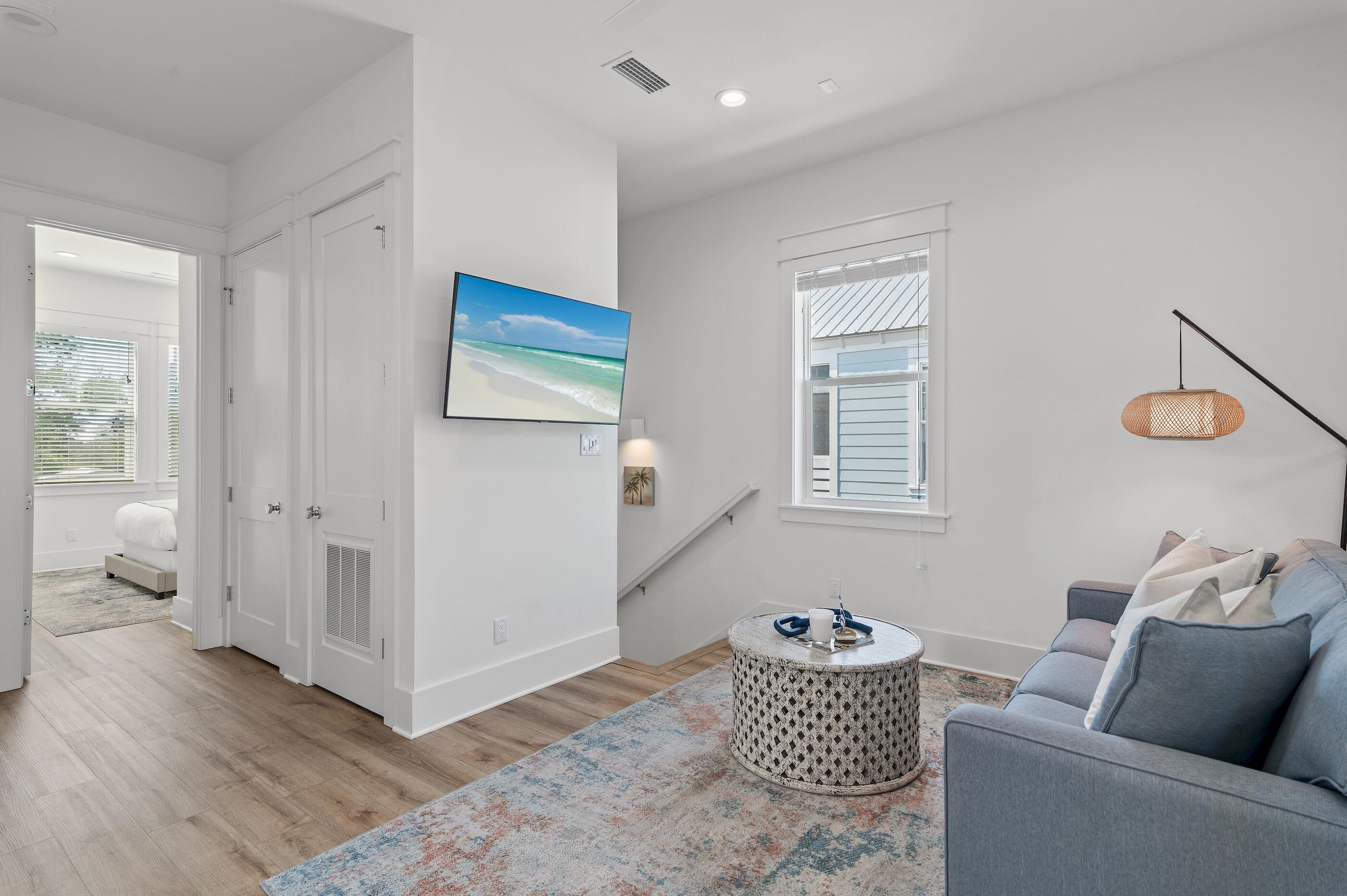 63 Sawgrass Lane Santa Rosa Beach, FL 32459 - Photo 17 of 51 a living room with furniture and a window