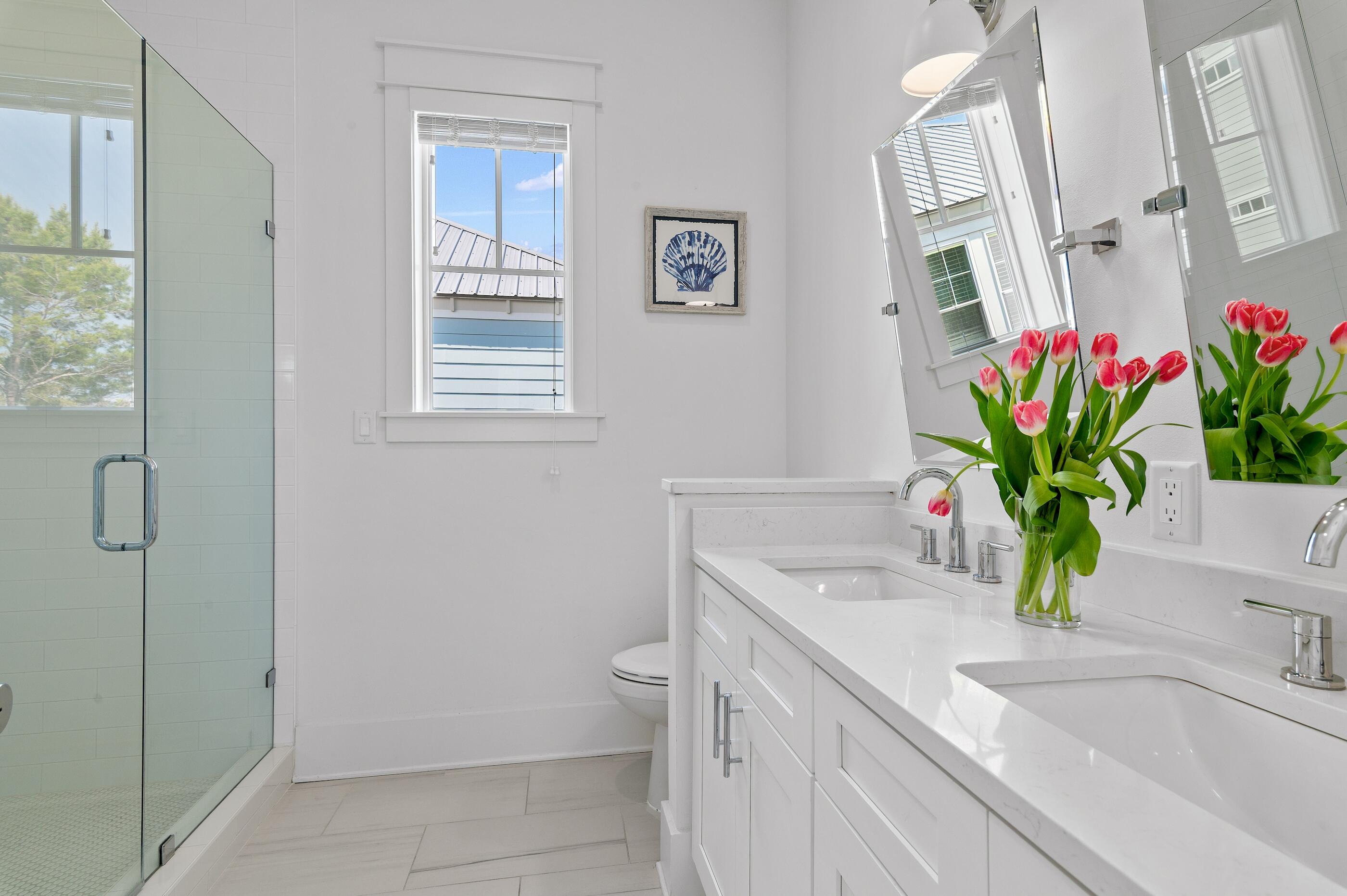 63 Sawgrass Lane Santa Rosa Beach, FL 32459 - Photo 23 of 51 a bathroom with a granite countertop sink a toilet and a shower