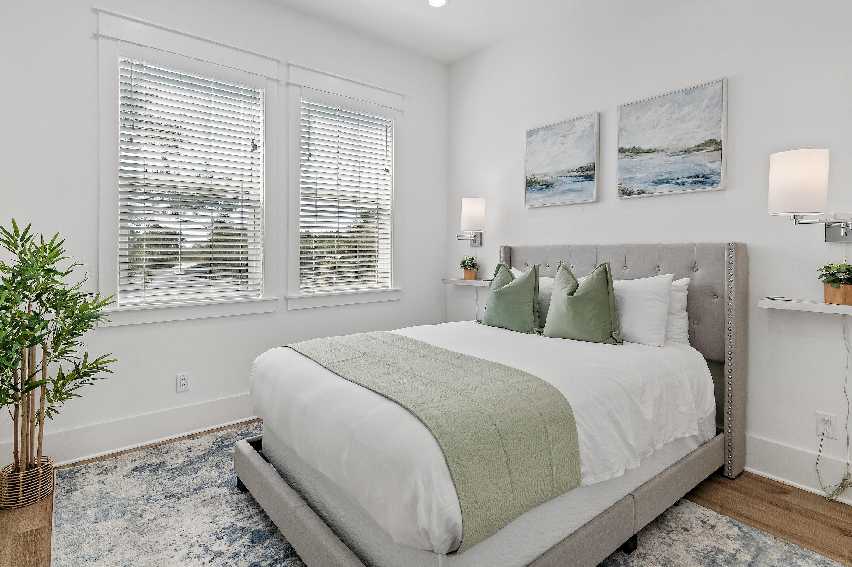 63 Sawgrass Lane Santa Rosa Beach, FL 32459 - Photo 27 of 51 a large bed sitting in a bedroom next to a window and a potted plant
