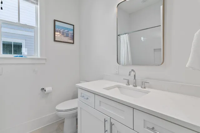 a view of a house with pool and sitting area