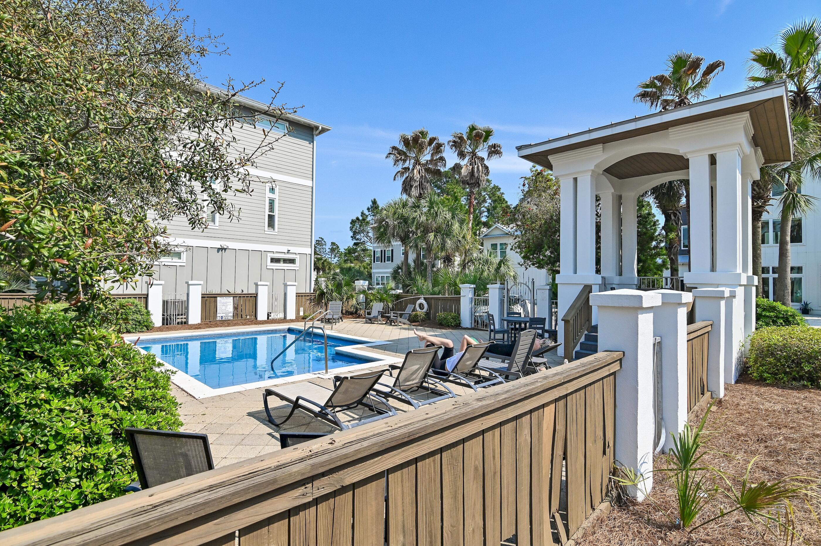 63 Sawgrass Lane Santa Rosa Beach, FL 32459 - Photo 30 of 51 a view of a house with pool and sitting area