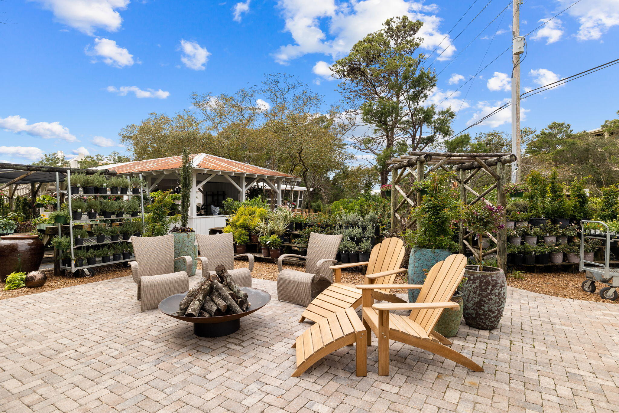 63 Sawgrass Lane Santa Rosa Beach, FL 32459 - Photo 47 of 51 a view of a patio with couches chairs and potted plants