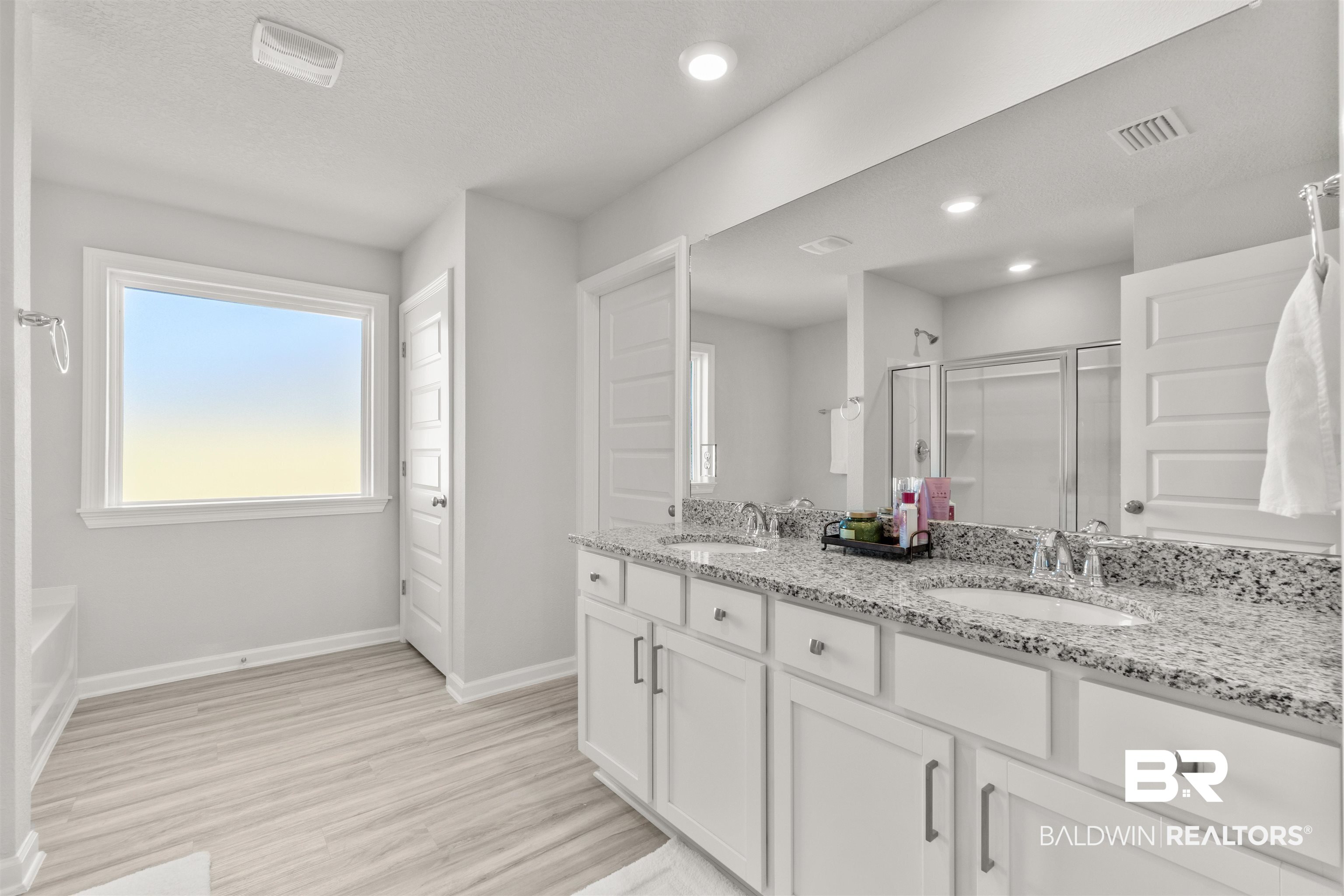 24472 Ringneck Loop Elberta, AL 36530 - Photo 21 of 46 Bathroom featuring hardwood / wood-style flooring, vanity, and walk in shower