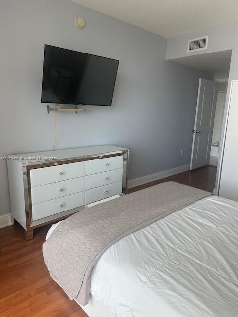 1250 South Miami Avenue, Unit 2013 Miami, FL 33130 - Photo 13 of 19 a bedroom with a bed and a flat screen tv