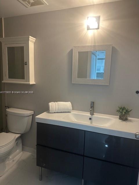 1250 South Miami Avenue, Unit 2013 Miami, FL 33130 - Photo 16 of 19 a bathroom with a sink toilet and mirror