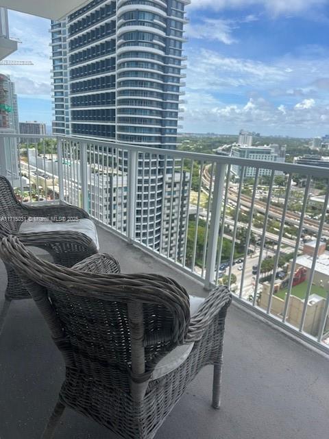 1250 South Miami Avenue, Unit 2013 Miami, FL 33130 - Photo 19 of 19 a roof deck with couch and city view