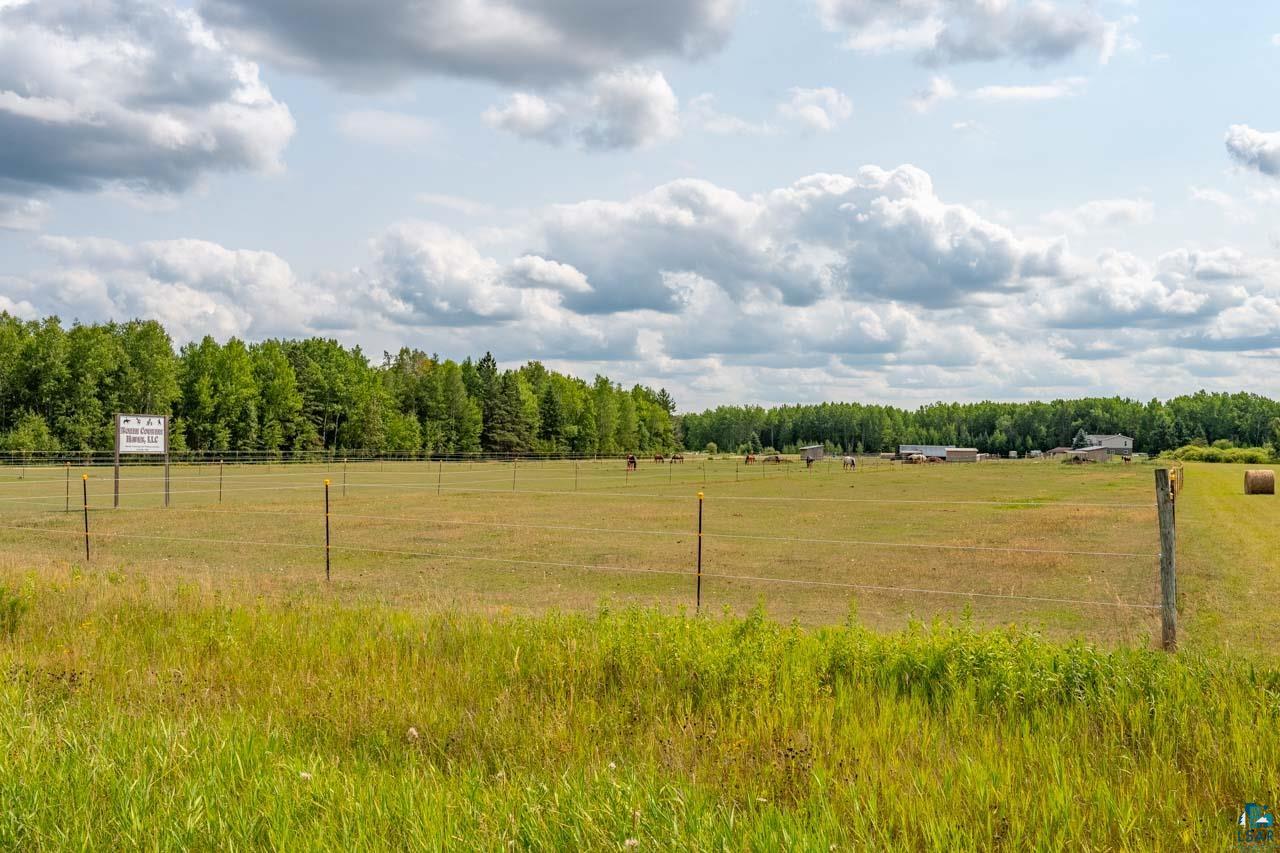 3201 Wilderness Road Makinen, MN 55763 - Photo 45 of 52 Expansive open field with scattered buildings and mature tree line