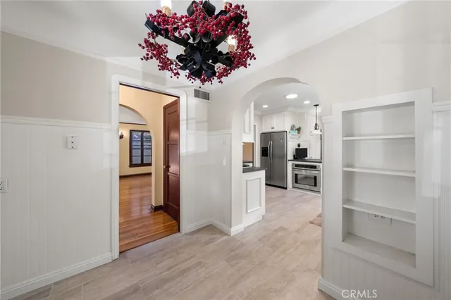 a view of a room with a chandelier and living room
