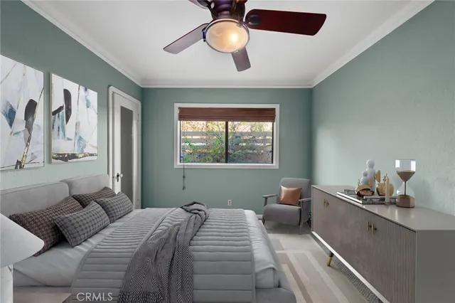 a bedroom with a large bed and a window