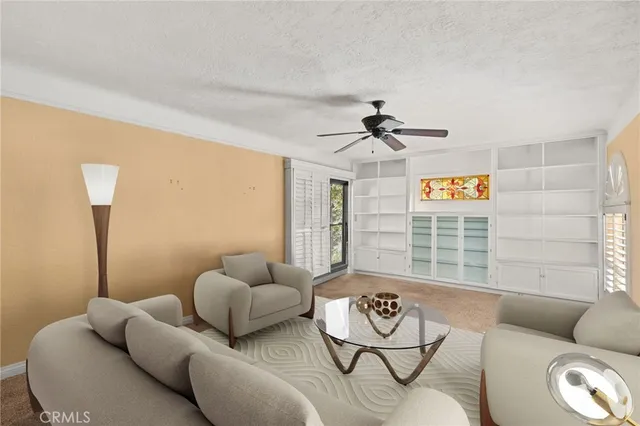 a living room with furniture and a window