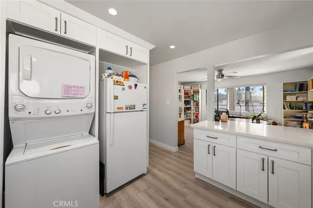 a kitchen with a refrigerator and sink