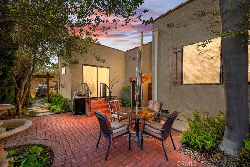 3754 California Long Beach, CA 90807 - Photo 3 of 38 a backyard of a house with table and chairs